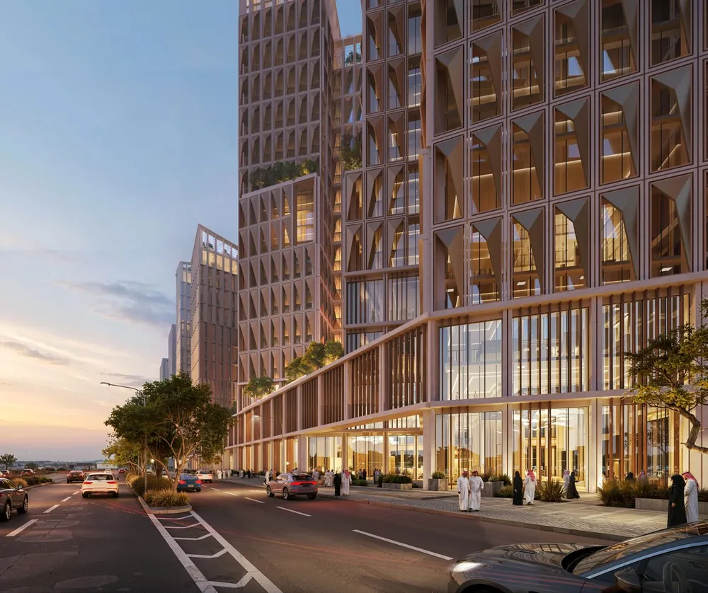 North View, Riyadh — the tower façade and retail colonnade at dusk